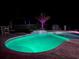 Relaxing pool area with landscape lighting at 9950 Nw 11Th Ter, Ocala, FL 34475