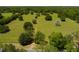 Lush acreage featuring a path winding through trees and vibrant greenery at 11420 Nw 110Th Ave, Reddick, FL 32686