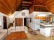 Open living space featuring kitchen, bar and stairway under impressive wood ceiling at 11420 Nw 110Th Ave, Reddick, FL 32686