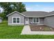 Inviting single-story home with a well-manicured lawn and a walkway leading to the front door at 12 Oak Circle Pass, Ocala, FL 34472