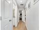 Hallway connecting bathroom and bedroom, with doors leading to other areas of the home at 12 Oak Circle Pass, Ocala, FL 34472