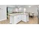 Kitchen island with granite countertop overlooks the living and dining areas at 12 Oak Circle Pass, Ocala, FL 34472
