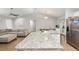 Kitchen island with granite countertop overlooks the living area at 12 Oak Circle Pass, Ocala, FL 34472