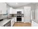 Well-equipped kitchen showcasing stainless steel appliances, granite countertops, and ample cabinet space at 12 Oak Circle Pass, Ocala, FL 34472