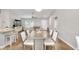 Open living space with a dining area, kitchen, and breakfast bar, perfect for entertaining and everyday living at 12 Oak Circle Pass, Ocala, FL 34472