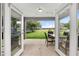 Patio with grilling area, seating, and view of backyard at 12 Oak Circle Pass, Ocala, FL 34472