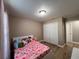 Cozy bedroom with wood floors, closet, and soft, natural light at 12840 Sw 60Th Ct, Ocala, FL 34473