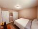 Bedroom with light-colored walls, wood laminate flooring, and large wardrobe at 12840 Sw 60Th Ct, Ocala, FL 34473