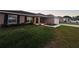 Cozy single-story home with a well-maintained lawn and a charming front entrance at 12840 Sw 60Th Ct, Ocala, FL 34473