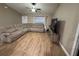 Cozy living room featuring a large sectional sofa and modern flooring at 12840 Sw 60Th Ct, Ocala, FL 34473