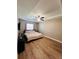 Main bedroom featuring wood laminate floors and a ceiling fan at 12840 Sw 60Th Ct, Ocala, FL 34473