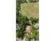 Beautiful aerial perspective of a property with a pool, adjacent to a pristine golf course at 1450 Se 73Rd Pl, Ocala, FL 34480