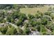 Stunning aerial view of a home surrounded by lush greenery and a golf course at 1450 Se 73Rd Pl, Ocala, FL 34480