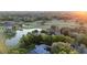 Breathtaking aerial view of a neighborhood, showcasing the nearby golf course and water features at 1450 Se 73Rd Pl, Ocala, FL 34480