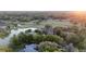 Gorgeous aerial view of a neighborhood on a golf course and surrounding water features at 1450 Se 73Rd Pl, Ocala, FL 34480