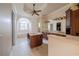 Well-lit bathroom featuring a vanity island, double sinks, and a soaking tub by a large arched window at 1450 Se 73Rd Pl, Ocala, FL 34480