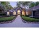 Elegant home with stone accents, manicured landscaping, and a welcoming entrance at 1450 Se 73Rd Pl, Ocala, FL 34480