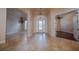 Inviting foyer features tile flooring, decorative chandeliers, and clear view to rooms throughout home at 1450 Se 73Rd Pl, Ocala, FL 34480