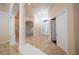 Foyer with decorative columns, open archways, tiled floors, chandelier, and large glass front door at 1450 Se 73Rd Pl, Ocala, FL 34480