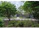 Beautiful home with manicured landscaping and an elegant entrance with stone accents at 1450 Se 73Rd Pl, Ocala, FL 34480