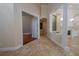 Open hallway with tile flooring, decorative columns, and archways at 1450 Se 73Rd Pl, Ocala, FL 34480