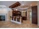 Spacious kitchen with dark wood cabinets, granite countertops, pendant lighting, and tile flooring at 1450 Se 73Rd Pl, Ocala, FL 34480