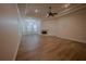 Spacious living room features hardwood floors, fireplace, and coffered ceiling at 1450 Se 73Rd Pl, Ocala, FL 34480
