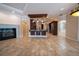 Open concept living area with kitchen featuring granite countertops, stainless steel appliances, and a fireplace at 1450 Se 73Rd Pl, Ocala, FL 34480