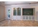 Spacious living room with built-in shelving and cabinets, perfect for entertaining guests at 1450 Se 73Rd Pl, Ocala, FL 34480