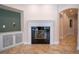 Elegant living room featuring a fireplace and an archway leading to another room at 1450 Se 73Rd Pl, Ocala, FL 34480