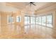 Bright and airy living room with multiple sliding glass doors leading to the lanai at 1450 Se 73Rd Pl, Ocala, FL 34480