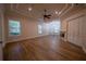 Spacious living room with beautiful floors, natural light, and custom ceiling design at 1450 Se 73Rd Pl, Ocala, FL 34480
