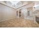 Spacious living room with tray ceilings, tile flooring, decorative columns and recessed lighting at 1450 Se 73Rd Pl, Ocala, FL 34480