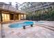 Screened-in pool and spa area, perfect for outdoor entertaining and relaxation at 1450 Se 73Rd Pl, Ocala, FL 34480