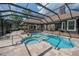 Beautiful pool and spa in screened in lanai, ideal for relaxation and outdoor living at 1450 Se 73Rd Pl, Ocala, FL 34480