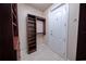 Well-organized walk-in closet with custom shelving and ample storage space at 1450 Se 73Rd Pl, Ocala, FL 34480
