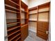 Spacious walk-in closet with custom shelving and drawers for optimal organization at 1450 Se 73Rd Pl, Ocala, FL 34480