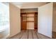 Large walk-in closet with wood shelving, providing plenty of storage space at 1450 Se 73Rd Pl, Ocala, FL 34480