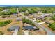 Scenic aerial shot showcasing a home in a peaceful residential area with lush greenery and clear blue skies at 14978 Sw 46Th Cir, Ocala, FL 34473