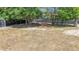 Expansive backyard with mature trees, tire swing, shed and full fence, providing a private outdoor space at 14978 Sw 46Th Cir, Ocala, FL 34473