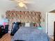 Inviting bedroom featuring patterned wallpaper and a soft, comfortable bed at 14978 Sw 46Th Cir, Ocala, FL 34473