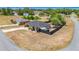 A single-story home with a fenced backyard, a long driveway, and a well-manicured lawn in a suburban setting at 14978 Sw 46Th Cir, Ocala, FL 34473