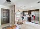 Bright kitchen featuring a dining area, stainless steel refrigerator and tiled flooring at 14978 Sw 46Th Cir, Ocala, FL 34473