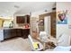 Open kitchen featuring dark cabinetry and stainless steel appliances at 14978 Sw 46Th Cir, Ocala, FL 34473