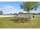 The backyard features a grassy lawn and a privacy fence, providing a secure outdoor space at 15044 Sw 35Th Avenue Rd, Ocala, FL 34473