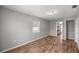 Spacious bedroom with natural light and a view of the fireplace in the other room at 15044 Sw 35Th Avenue Rd, Ocala, FL 34473