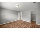 Neutral bedroom with wood-look flooring and a closet near the doorway at 15044 Sw 35Th Avenue Rd, Ocala, FL 34473
