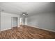 This is a bedroom featuring hardwood floors, closet, ceiling fan, and views into other rooms at 15044 Sw 35Th Avenue Rd, Ocala, FL 34473