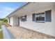 Inviting home featuring stone detail front porch and a classic color scheme at 15044 Sw 35Th Avenue Rd, Ocala, FL 34473