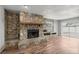 Stunning stone fireplace with unique accents and hardwood floors at 15044 Sw 35Th Avenue Rd, Ocala, FL 34473